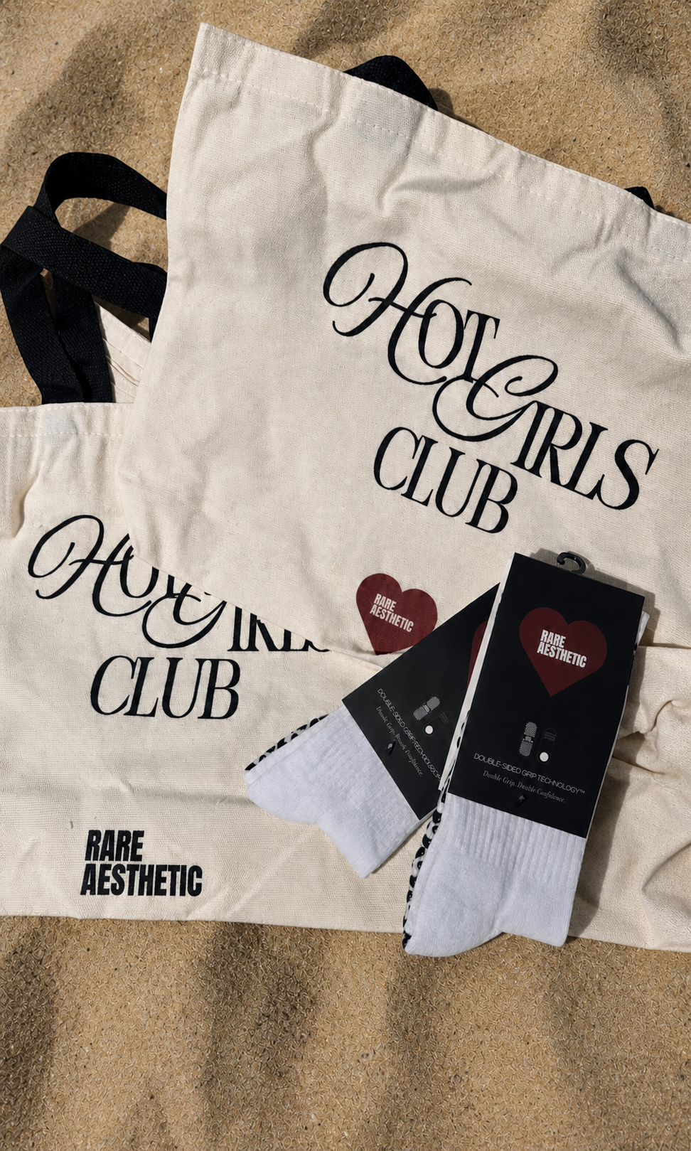 Rare Aesthetic Hot Girls Club totes and grip socks on sunlit sand